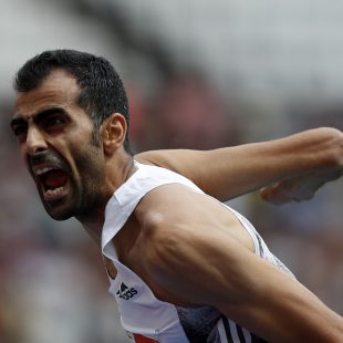 Syria's Majd Eddin Ghazal celebrates as he clears 230 in the Men's High Jump event during the the IAAF Diamond League Anniversary Games athletics meeting at the London Stadium in London on July 21, 2019. (Photo by Adrian DENNIS / AFP)ADRIAN DENNIS/AFP/Getty Images